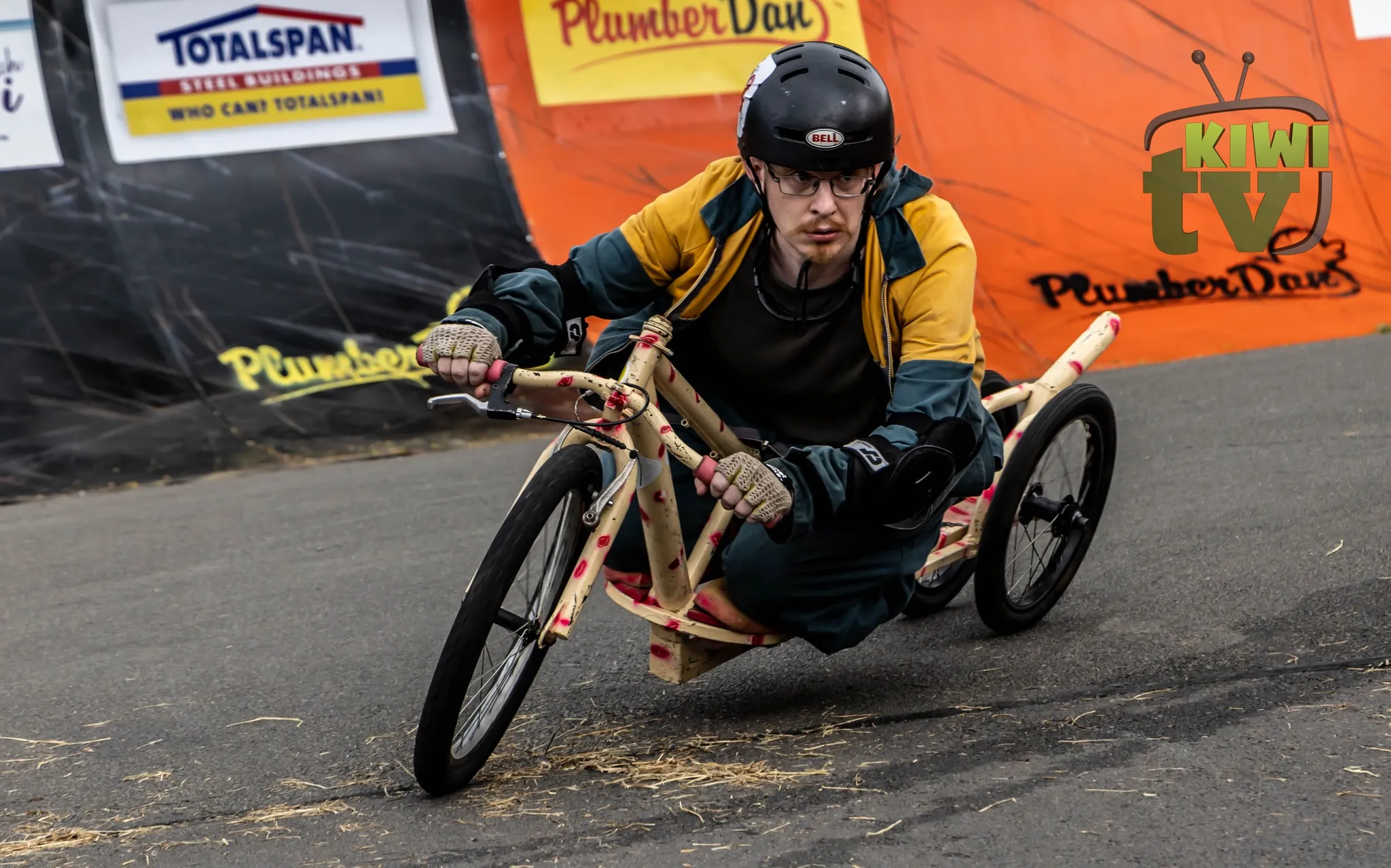 Volunteers wheeling karts back to pits