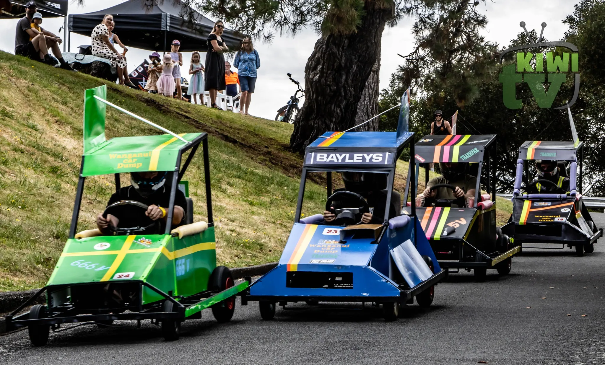 Driver fist-bumping pit crew after a run